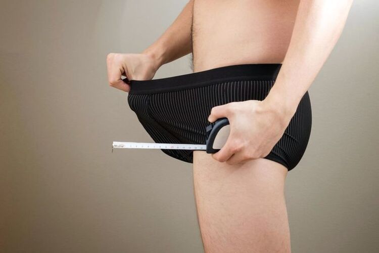 man with penile measuring tape before augmentation